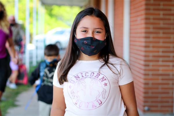 student smiles on first day of school